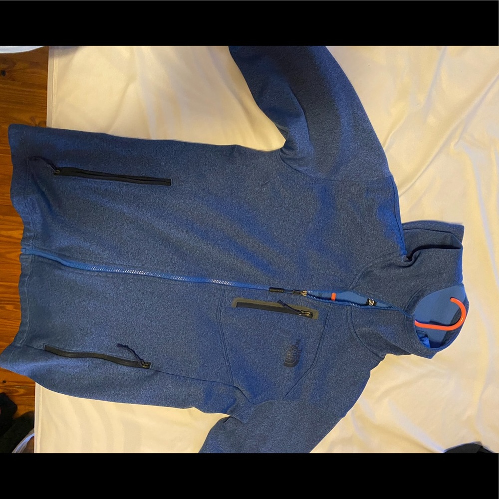 Blue men’s North Face jacket